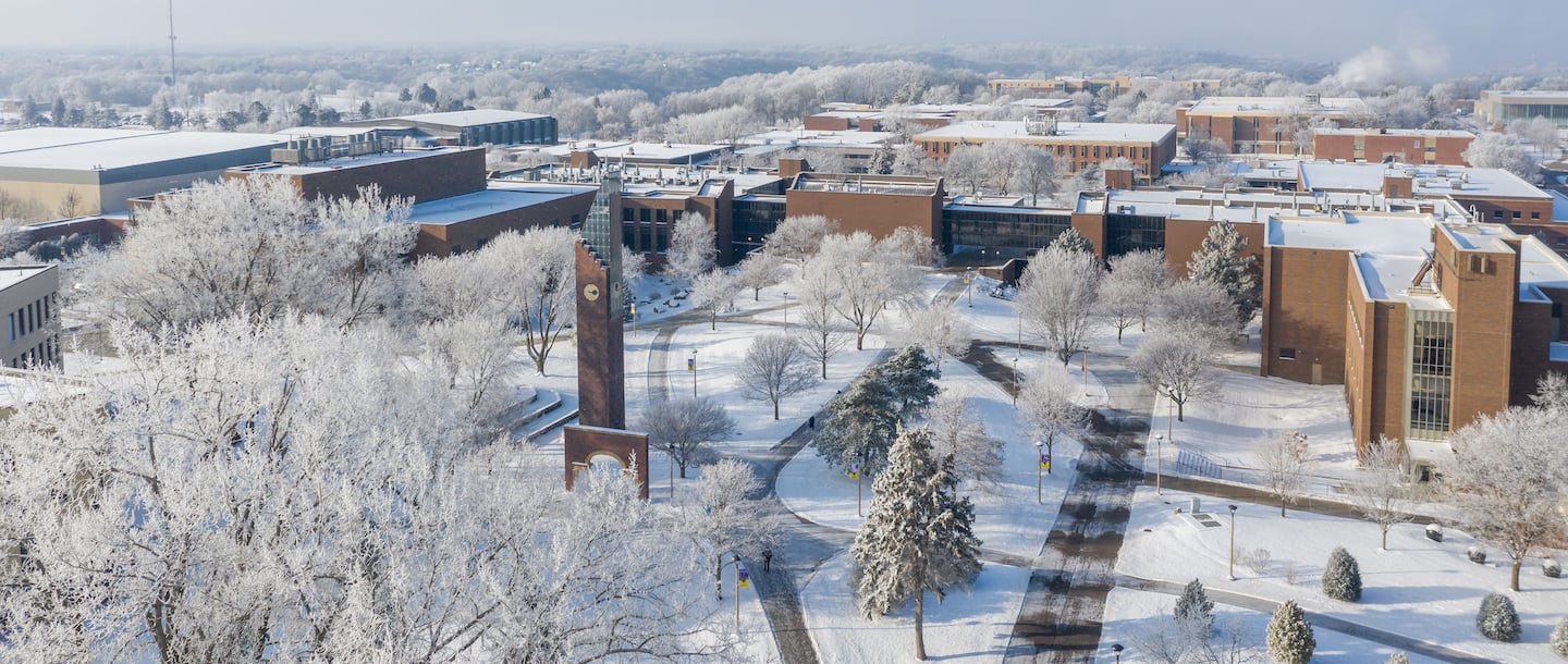 Aerial view of the Bell Tower and the Minnesota State University, Mankato campus during winter with snow on the ground